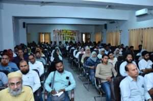 Students and teachers are in rapt attention during the lecture